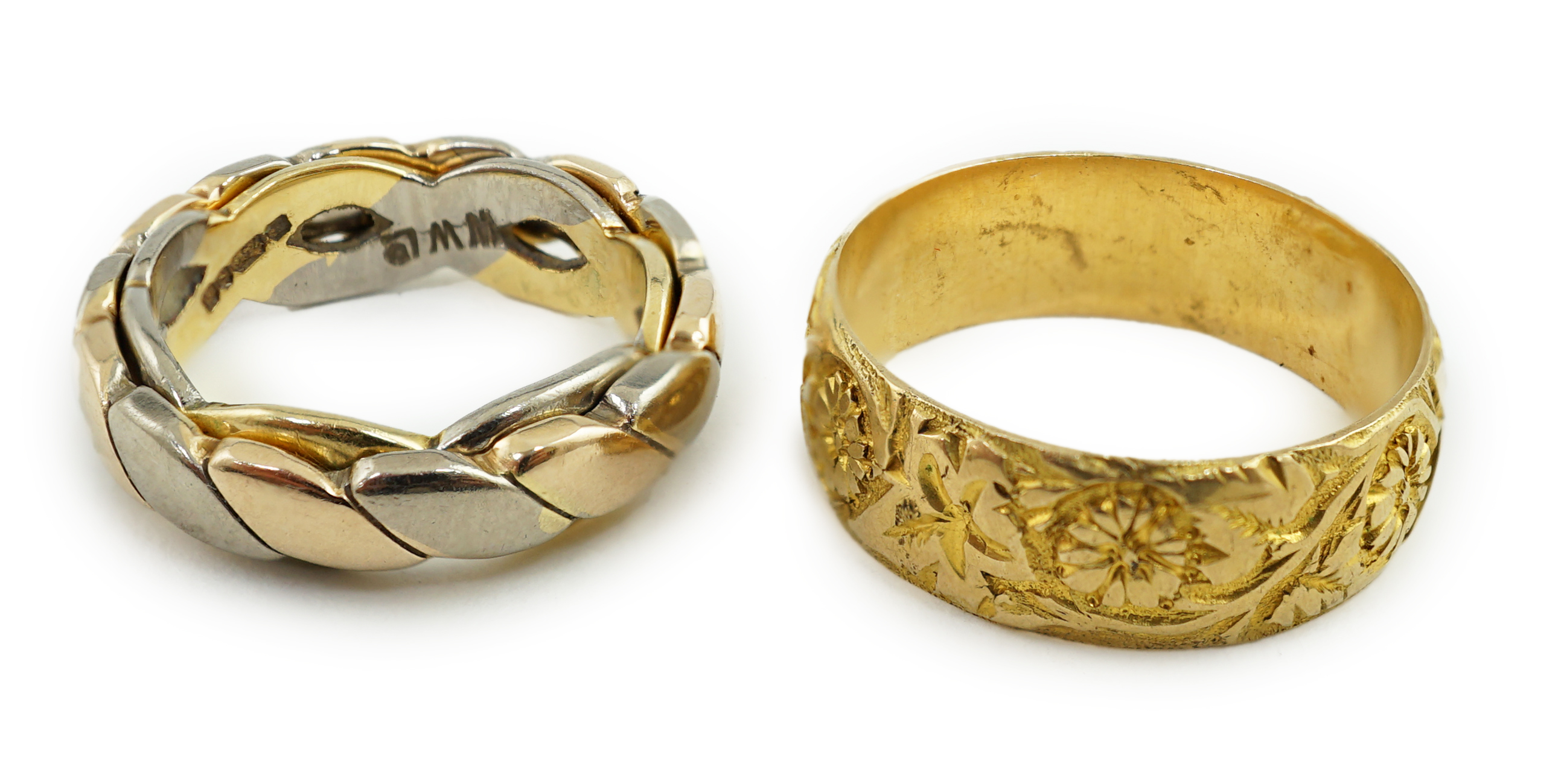 A George V engraved 18ct gold band, size M/N, together with two three or two colour 18ct gold bands